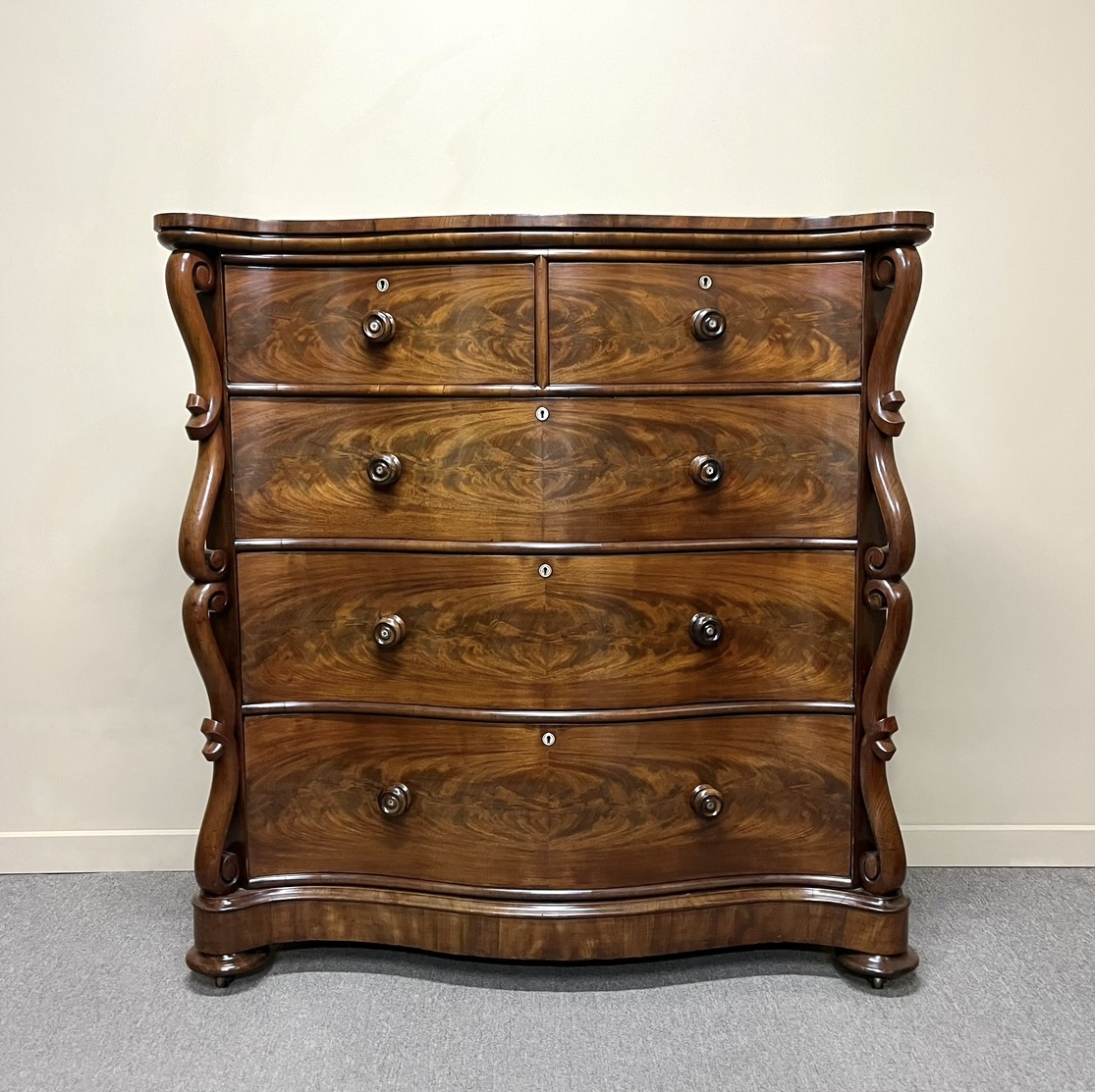 19th Century Flame Mahogany Serpentine Chest of Drawers